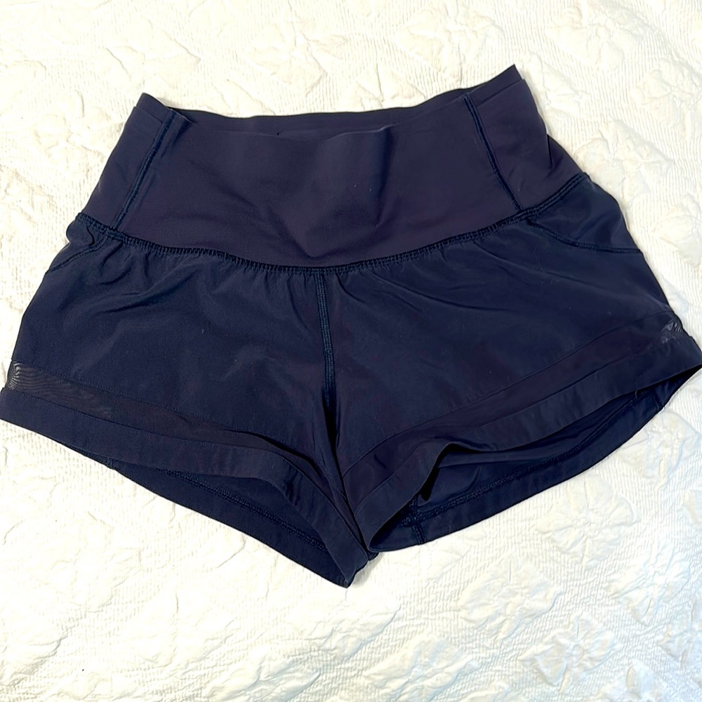 Lululemon running shorts. Size 2, 2.5 inch inseam, navy blue, hi rise, mesh side